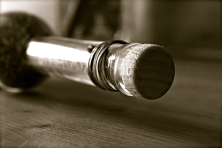 clear glass bottle on wooden board thumbnail
