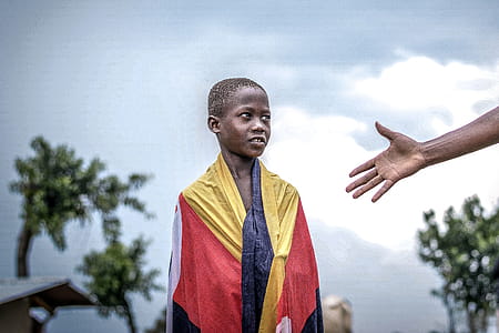 Person Wearing Red and Yellow Textile thumbnail