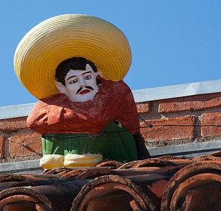 man in red long-sleeved top statue thumbnail