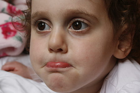 toddler girl taking close-up selfie thumbnail
