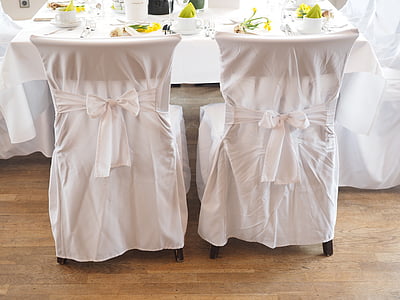 two white covered chairs thumbnail