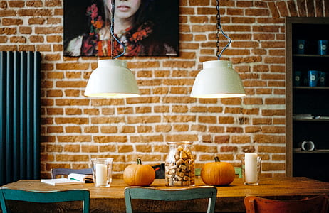 two pumpkins on brown wooden table thumbnail
