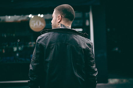 man wearing black leather jacket thumbnail