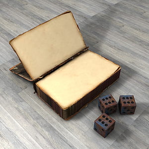 three dice and brown box on wooden surface thumbnail