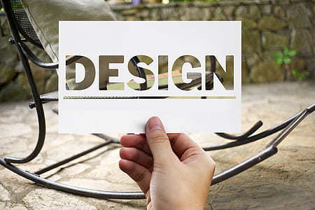 person holding white Design cut-out paper thumbnail