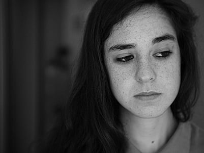 woman wearing collared shirt looking right direction thumbnail