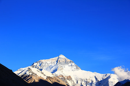 worm's-eye view of mountain under blue sky thumbnail