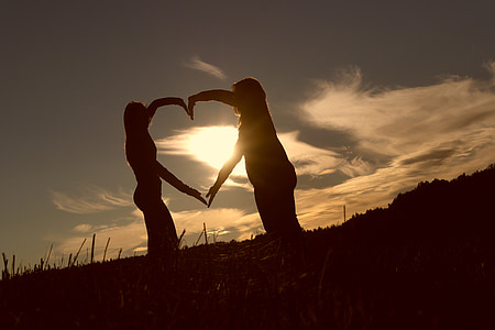 silhouette of two women during golden hour thumbnail
