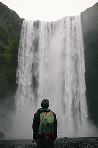 man in front of waterfall thumbnail