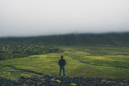 man standing above mountain thumbnail