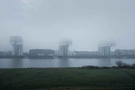 panoramic photography of three L-shaped buildings thumbnail