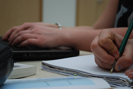 person using green ballpoint pen thumbnail