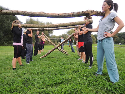 group of women carrying branches on their shoulders thumbnail