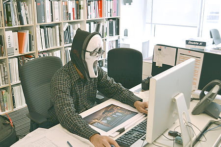 person using computer while sitting on chair thumbnail