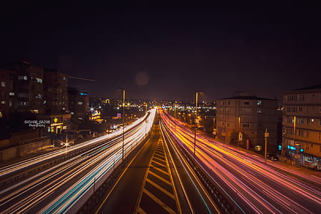 Time Lapse Photography of Road Beside Buildings thumbnail