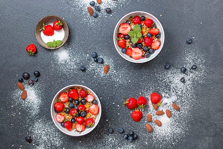 three round white bowls filled with strawberries thumbnail