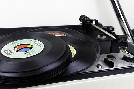 close-up photo of vinyl records on turntable thumbnail