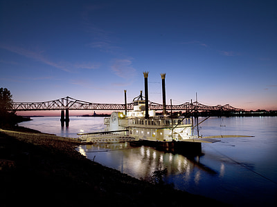 grey metal bridge over body of water during nigh time thumbnail