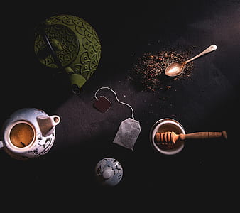 low-angle photography of teabag, kettle, spoon, and pestle thumbnail