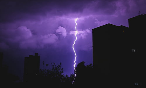 silhouette of buildings and lightning thumbnail