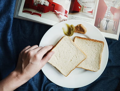 Person Touching the Bread on Plate thumbnail