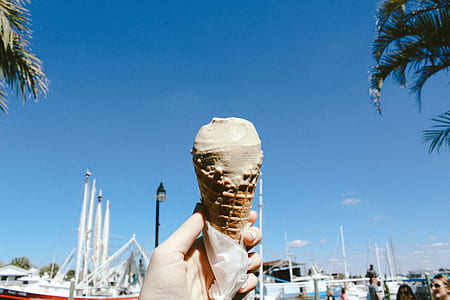 person holding ice cream thumbnail