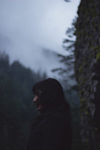 selective focus photography of woman in black coat thumbnail