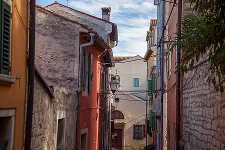 assorted-color building under blue sky at daytime thumbnail
