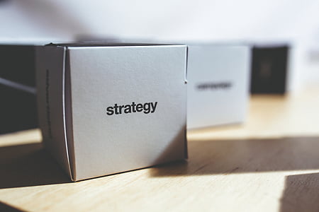 white Strategy box on brown wooden surface thumbnail