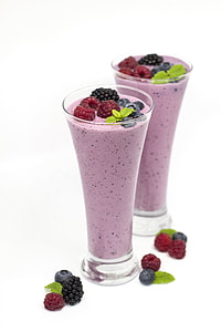 two glass of raspberry shakes against white background thumbnail