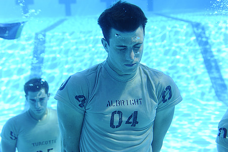 men under pool photo thumbnail
