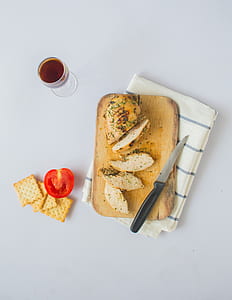 pastry on chopping board beside knife thumbnail