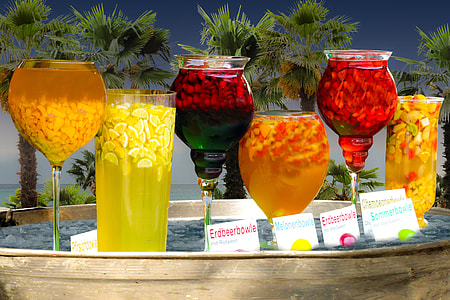 assorted cocktail drinks on tray outdoor during daytime thumbnail