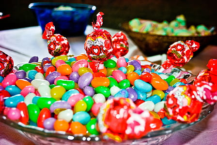 assorted-color candy in clear glass bowl thumbnail