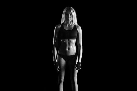 woman in black and pink bikini set with black background thumbnail