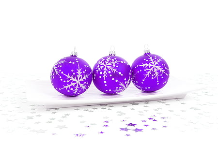 three purple bauble balls on top of white surface thumbnail