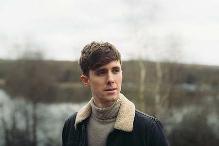 man looking sideward with blurred background thumbnail