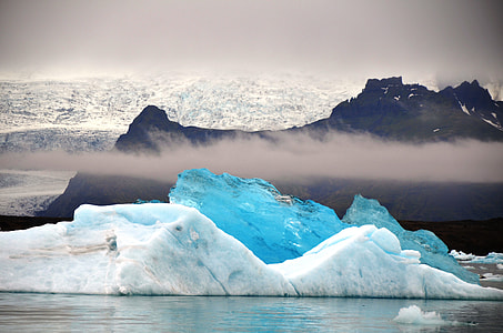 white iceberg on body of water thumbnail