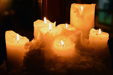 lighted white pillar candles thumbnail