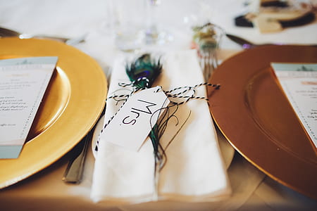 two brown plates beside white table napkin thumbnail