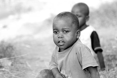 grayscale photography of two boy sitting on floor thumbnail