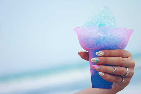 person holding ice cream cone thumbnail