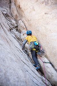 person walking toward rocky mountain thumbnail