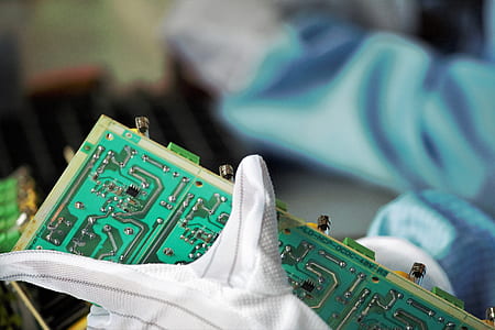 person holding circuit board thumbnail