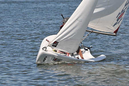 person riding sailboat during daytime thumbnail