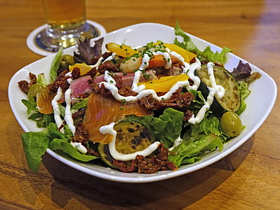 vegetable salad on white plate placed on brown table thumbnail