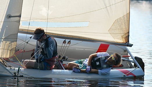 two men riding boat thumbnail