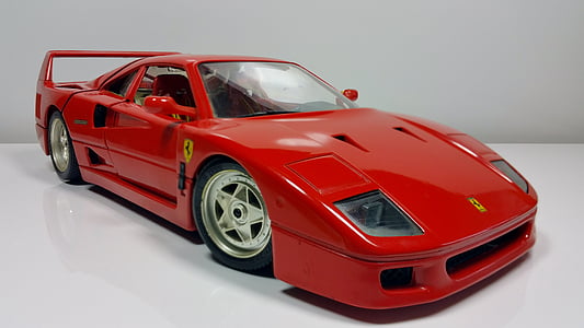 close-up photography of red Ferrari coupe die-cast scale model thumbnail