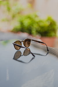 shallow focus photography of brown sunglasses thumbnail