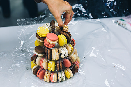 Colourful sweet macarons arranged in a tower thumbnail